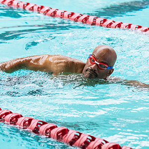 Man swimming in lap pool
